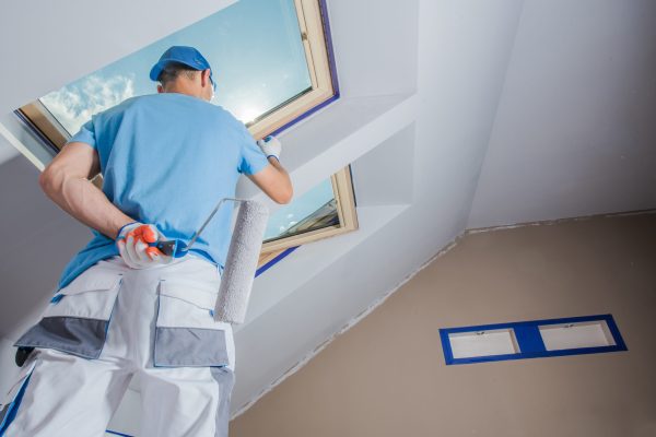 Caucasian Men Painting His Apartment. Construction Theme.